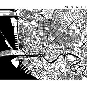May include: A black and white map of Manila, Philippines, with the city's street grid and waterways. The word "MANILA" is printed in a simple sans-serif font at the top. The map has a minimalist, graphic design.
