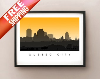 May include: Framed art print featuring a silhouette of Quebec City against an orange and yellow gradient sky. The city skyline is depicted in shades of gray and black, with the city name printed in white at the bottom.