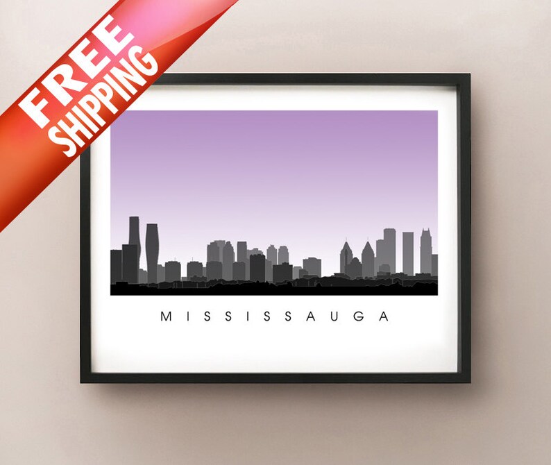 May include: Framed art print featuring a black and white silhouette of the Mississauga skyline against a gradient purple sky. The word "MISSISSAUGA" is printed in black at the bottom. The print is in a black frame.