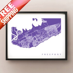 May include: Framed print featuring a detailed map of Freeport in a vibrant purple hue against a white background. The map is encased in a sleek black frame. The word "FREEPORT" is printed in a dark font at the bottom of the print.