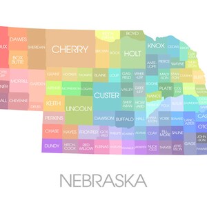 May include: A colorful map of Nebraska, divided into counties, each with a different pastel color. County names are displayed in white text. The word "NEBRASKA" is written in gray at the bottom of the image.
