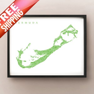 May include: A framed print of Bermuda, featuring a detailed green map of the island against a white background. The word "BERMUDA" is printed in green above the map. The print is in a black frame. A red banner with the words "FREE SHIPPING" is in the upper left corner.