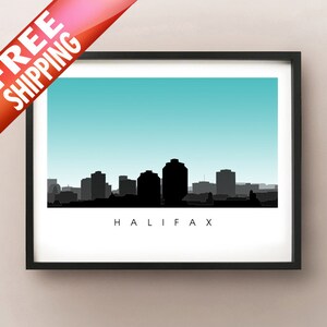May include: A framed art print depicting the Halifax skyline in silhouette against a light blue backdrop. The word "HALIFAX" is printed in a clean font below the skyline. The image is in a black frame.