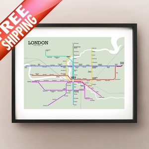 May include: Framed print of a London, Ontario, subway map. The map features colorful lines representing subway routes, with station names labeled. The print is in a black frame and includes the text "LONDON ONTARIO".