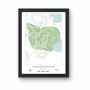 May include: Framed print of the Juniper Hills Golf Course map in black. The course layout is depicted in green, with water features in light blue. The map includes the course name and location.
