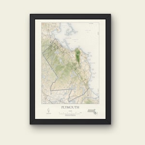 May include: A framed map of Plymouth, Massachusetts, in a black frame. The map features detailed topographical information, including roads, water bodies, and green areas. The word "PLYMOUTH" is printed at the bottom, with a legend and the Massachusetts state outline.