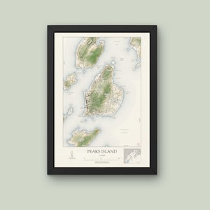May include: A framed map of Peaks Island, Maine, with a detailed illustration of the island's geography and coastline. The map is printed in shades of green, blue, and brown, with text labels for various points of interest.