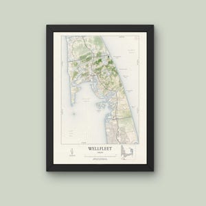 May include: A black framed map of Wellfleet, Massachusetts, with a detailed outline of the town and surrounding coastline. The map features a green and brown color scheme, with a scale bar and compass rose in the bottom right corner.