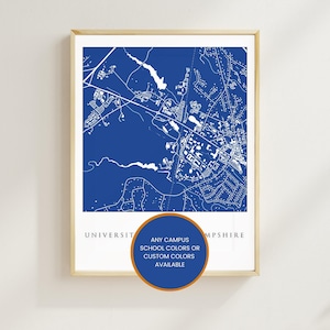 May include: A rectangular wall print featuring a blue and white map of the University of New Hampshire campus. Below the map, the text reads UNIVERSITY OF NEW HAMPSHIRE. A circular orange and blue badge overlays the bottom center with text.