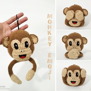 Może przedstawiać: Szydełkowa emotikona małpy w odcieniach brązu i beżu, z czarnym sznurkiem do zawieszenia. Małpa ma uśmiechnięte czerwone usta i duże czarne oczy. Obrazek przedstawia również trzy inne emotikony małpy z różnymi wyrazami twarzy.