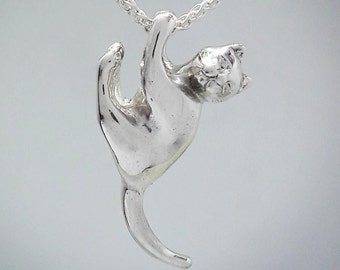 Playful cute silver cat pendant