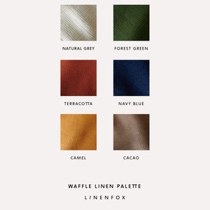May include: Waffle linen fabric swatches in natural grey, forest green, terracotta, navy blue, camel, and cacao colors. The swatches are arranged in two rows of three. The text "Waffle Linen Palette" and "LINENFOX" are below the swatches.