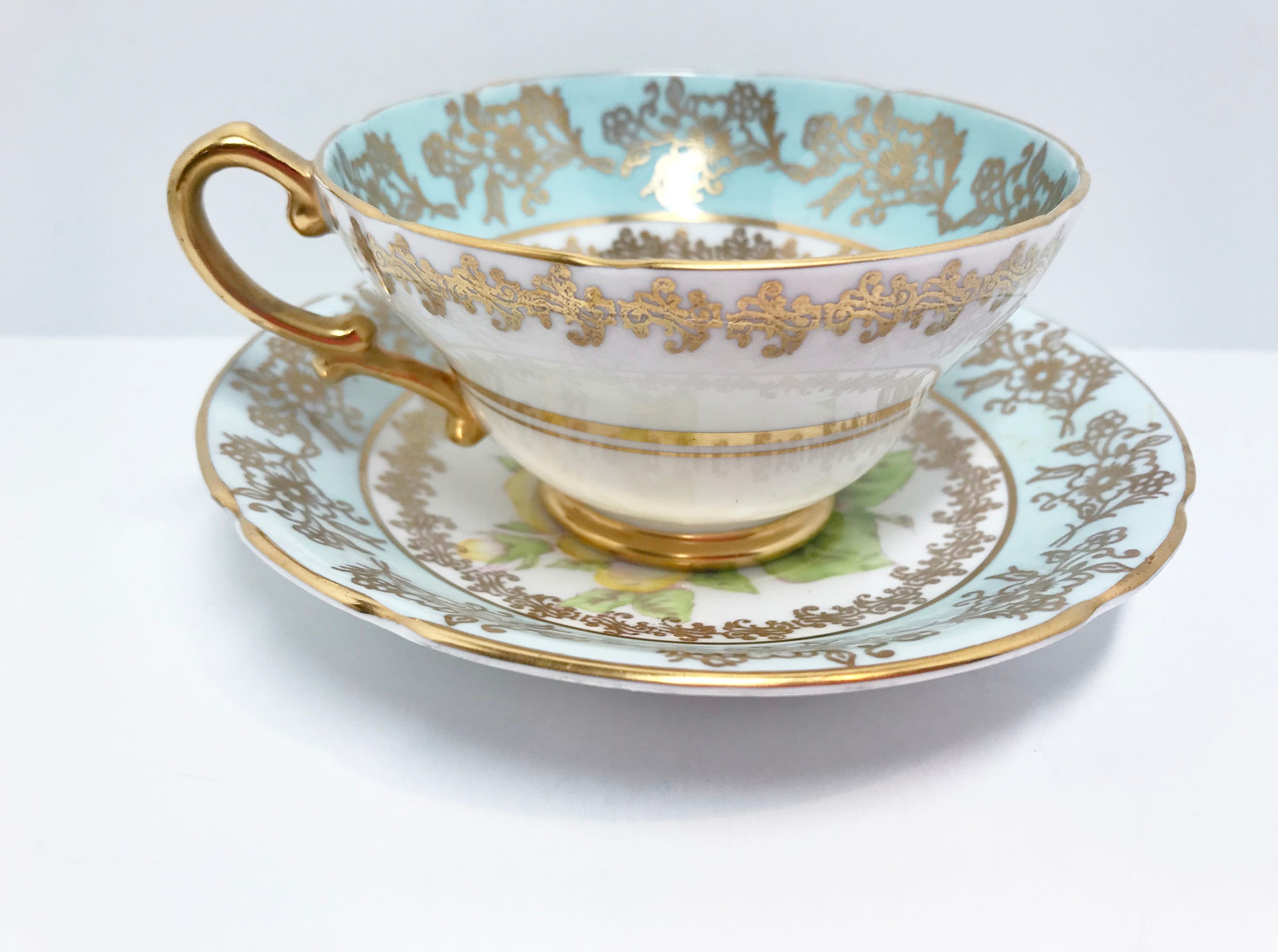tea cup with wooden saucer