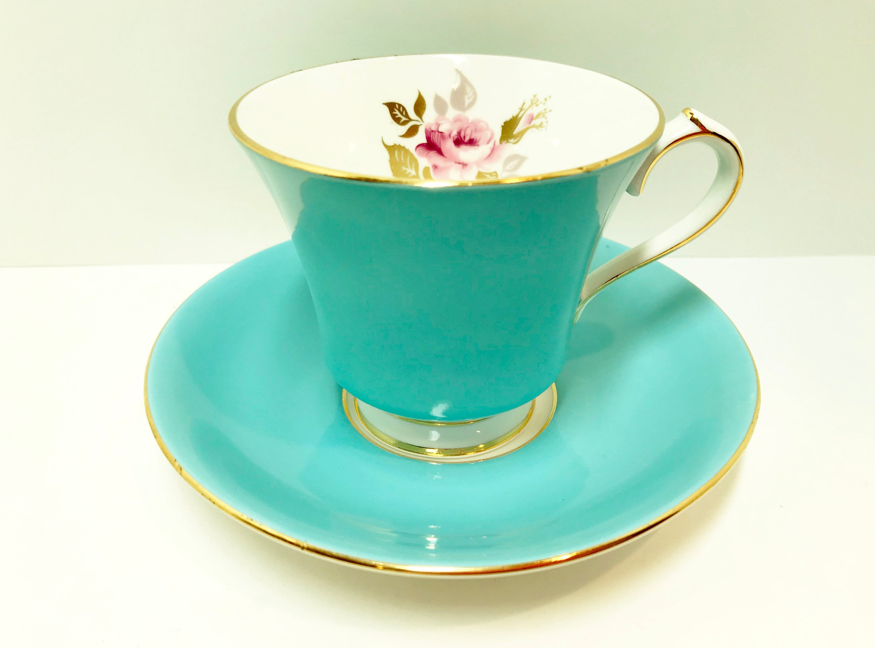 tea cup with wooden saucer