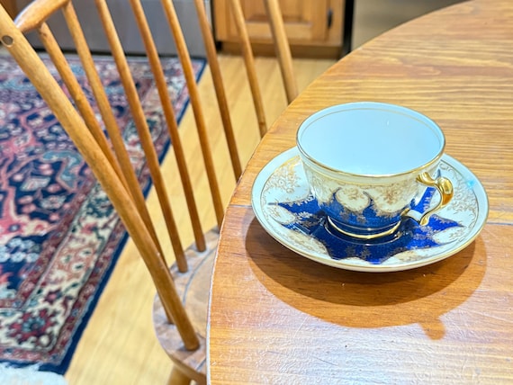 Crown Staffordshire Teacup and Saucer: Blue and Gold
