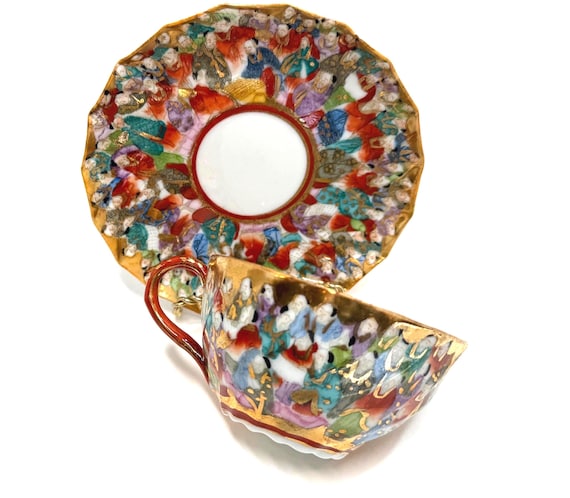 Kutani Teacup and Saucer: Thousand Faces Teacup