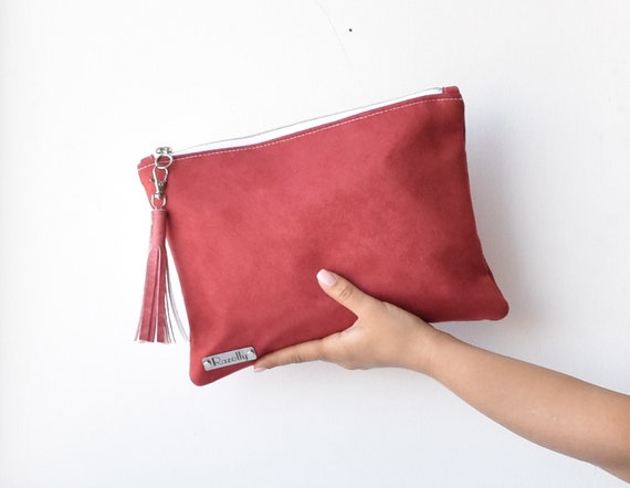red suede clutch bag