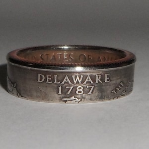 DELAWARE selado tamanho de anel ou pingente de moeda de um quarto dos EUA