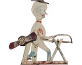 Very folky metal whirligig made from found objects. Weathered paint, mainly white, red with black yellow highlights. (Offers Considered)