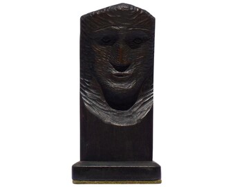 Second of two Folk art carved busts mounted on dark green stone bases. It has a strong face and stained very dark brown. (Offers Considered)
