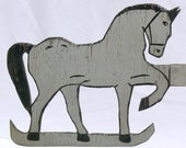 A nice wooden horse weathervane in weathered gray and black paint on both sides with old spark plug added to balance. (Offers Considered)