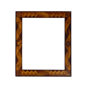 A  very intricate and finely made marquetry frame withmirror. It can hang vertically or horizontally. (Offers Considered)