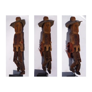 A Folk Art jointed carving of a very primitive man wearing a felt hat, with tacks for eyes. Wonderful Limberjack. (Offers Considered)