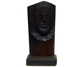 First of two Folk art carved busts mounted on dark green stone bases. It has a strong face, and stained very dark brown. (Offers Considered)