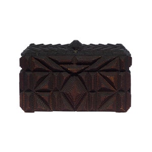 A  fairly large tramp art box with elaborate decoration. Cigar box wood over a crate wood base. Finely alligatored. (Offers Considered)