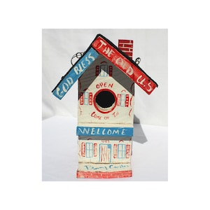 Birdhouse by Benny Carter painted with American flags lots of inscriptions: Welcome, God Bless The Old U.S, Go Panthers. (Offers Considered)