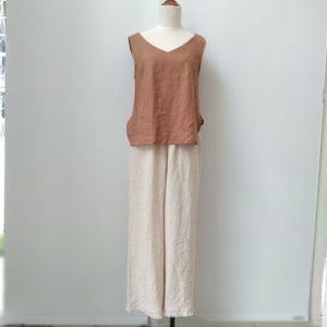 A linen set of linen top  and tie waist fringe hem pants
