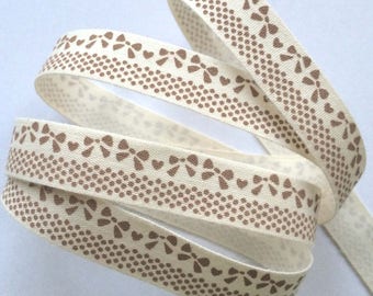 decorative Ribbon: "Brown bow" on an ecru background