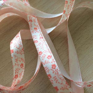 pretty ecru satin ribbon with orange floral pattern