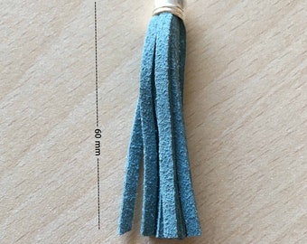 Tip on metal ring with blue grey suede tassel