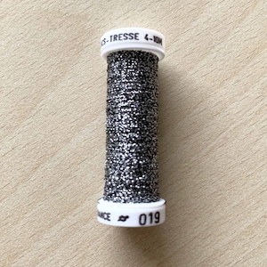 spool of metallized silkworm thread 019