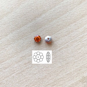May include: Two orange flower-shaped crystal beads with a hole in the centre. A diagram of the bead shape is shown below.