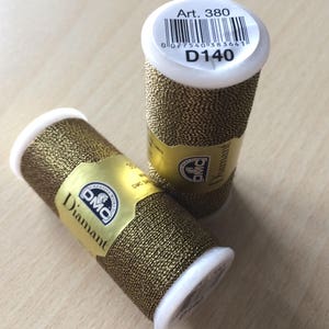 DMC Diamond embroidery thread in gold brown color 140