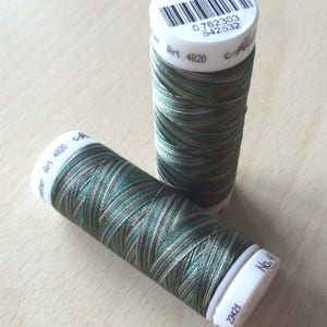 May include: Two spools of green, brown, and beige embroidery thread. The spools are labeled with the number 4820 and the text "Art. 4820".