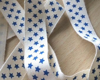 decorative ribbon: "blue stars" on ecru background