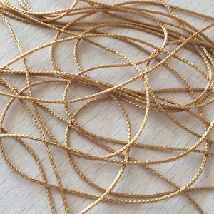 cordón bastante fino 1mm color beige oscuro dorado 011