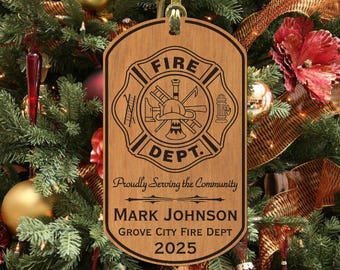 May include: Wooden Christmas ornament with a firefighter emblem, the words "FIRE DEPT." and "Proudly Serving the Community." The ornament also includes the name "MARK JOHNSON", "GROVE CITY FIRE DEPT" and the year "2025".