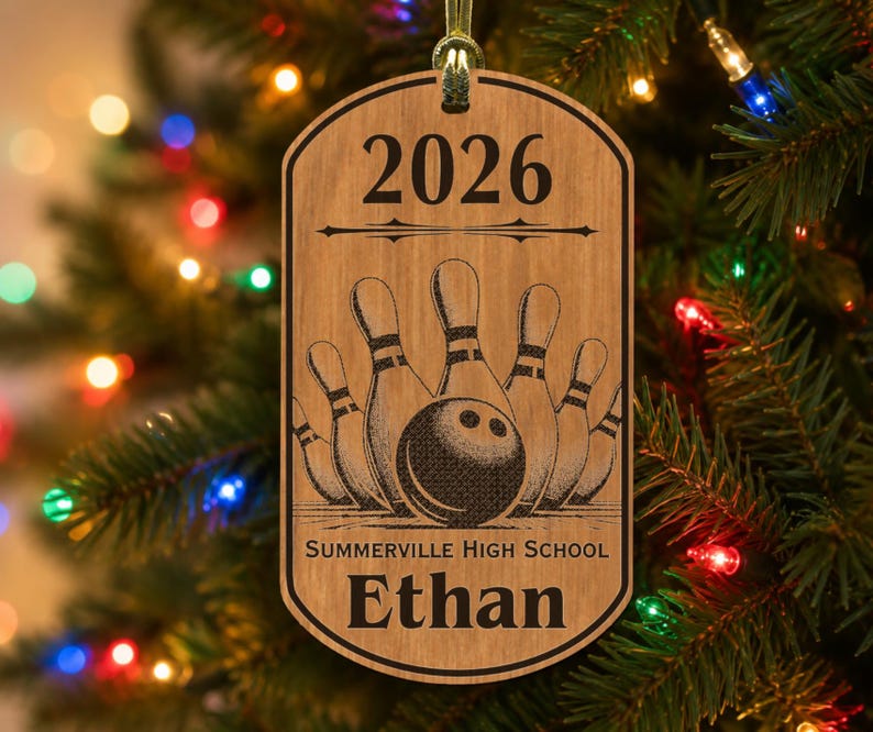 May include: A rectangular wooden ornament with rounded corners featuring a laser-engraved bowling design. The text 2026 is at the top, followed by a bowling ball and pins, with Summerville High School and the name Ethan engraved below.