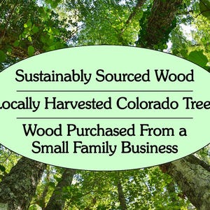 May include: A light green oval graphic overlaying a low-angle view of a forest canopy. The text reads: "Sustainably Sourced Wood", "Locally Harvested Colorado Trees", and "Wood Purchased From a Small Family Business" in black serif font.