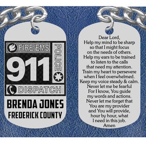 May include: A silver keychain with a black and white 911 dispatch tag. The tag also includes the words "FIRE/EMS" and "POLICE". The back of the tag has a prayer for first responders, with the name "Brenda Jones" and "Frederick County".