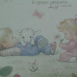 May include: A vintage illustration of two children in a field with a lamb. The boy is lying on his back with the lamb on his stomach. The girl is standing and holding a daisy. The text "in green pastures... -Psalm 23:2" is in the top right corner of the image.