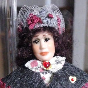Porcelain dollhouse doll