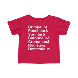 May include: Red toddler t-shirt with white text that reads "Grimpeur & Puncheur & Sprinter & Baroudeur & Cronoman & Rouleur & Domestique"