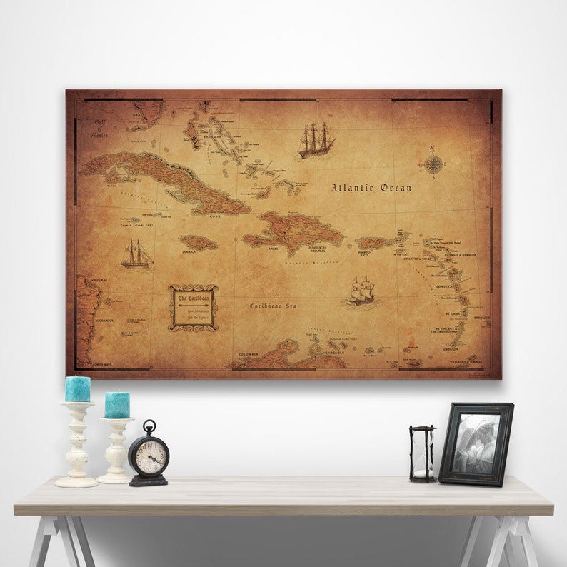 May include: A vintage-style map of the Caribbean islands with a brown background and a compass rose in the top right corner. The map shows the islands of Cuba, Hispaniola, Puerto Rico, and the Virgin Islands. The map also includes the text "The Caribbean" and "Atlantic Ocean".