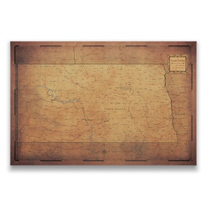 May include: An antique-style map of North Dakota with a vintage, faded look. The map shows the state's borders, major cities, and rivers. The map is surrounded by a brown border and has a title card in the upper right corner that reads "North Dakota".