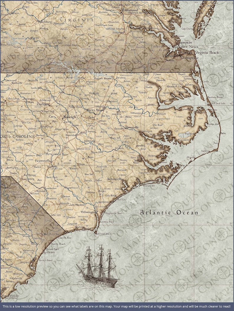 May include: A vintage-style map of the US states of Virginia and North Carolina, with a detailed outline of the coastline and major cities labeled. The map is printed on a beige background with brown lines and text. A small sailboat is shown in the bottom right corner of the map, sailing on the Atlantic Ocean.